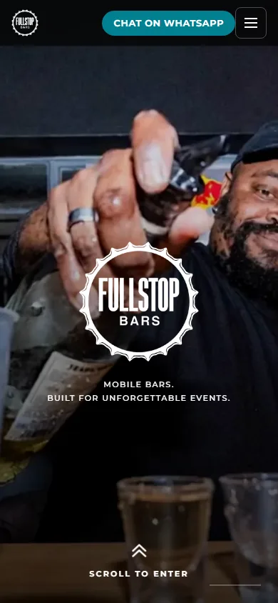 The Fullstop Bars homepage on a phone: a Chat on WhatsApp button in the header beside the menu, the Fullstop Bars mark over bartender photography, the line Mobile bars. Built for unforgettable events. and a Scroll to enter cue